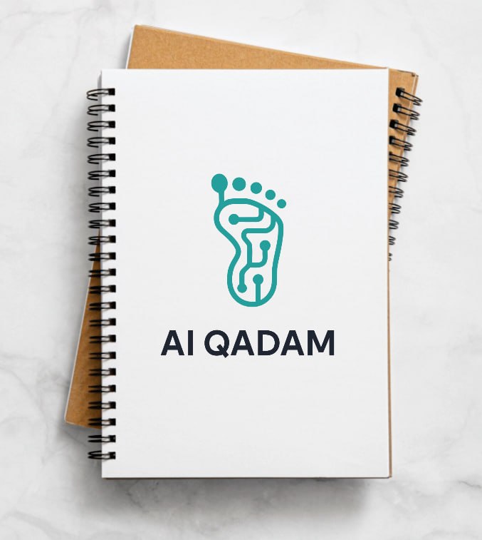AI Qadam spiral notebook with full lockup centred on the cover; kraft variant visible behind the white one