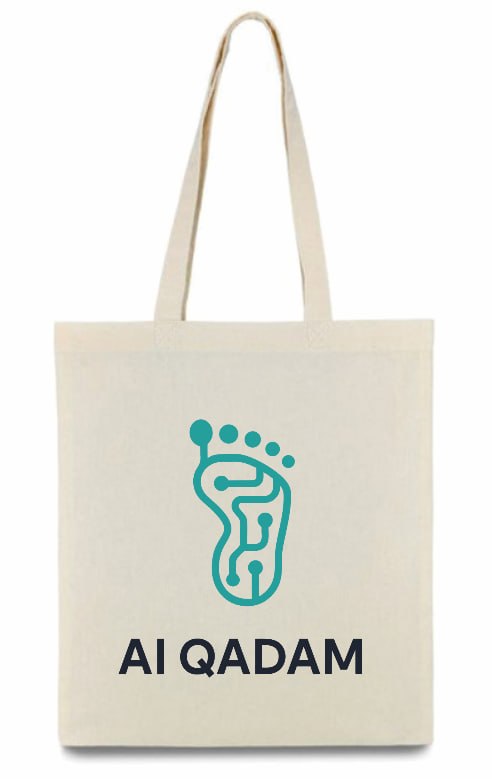 AI Qadam cream-canvas tote bag with the full lockup printed on the front